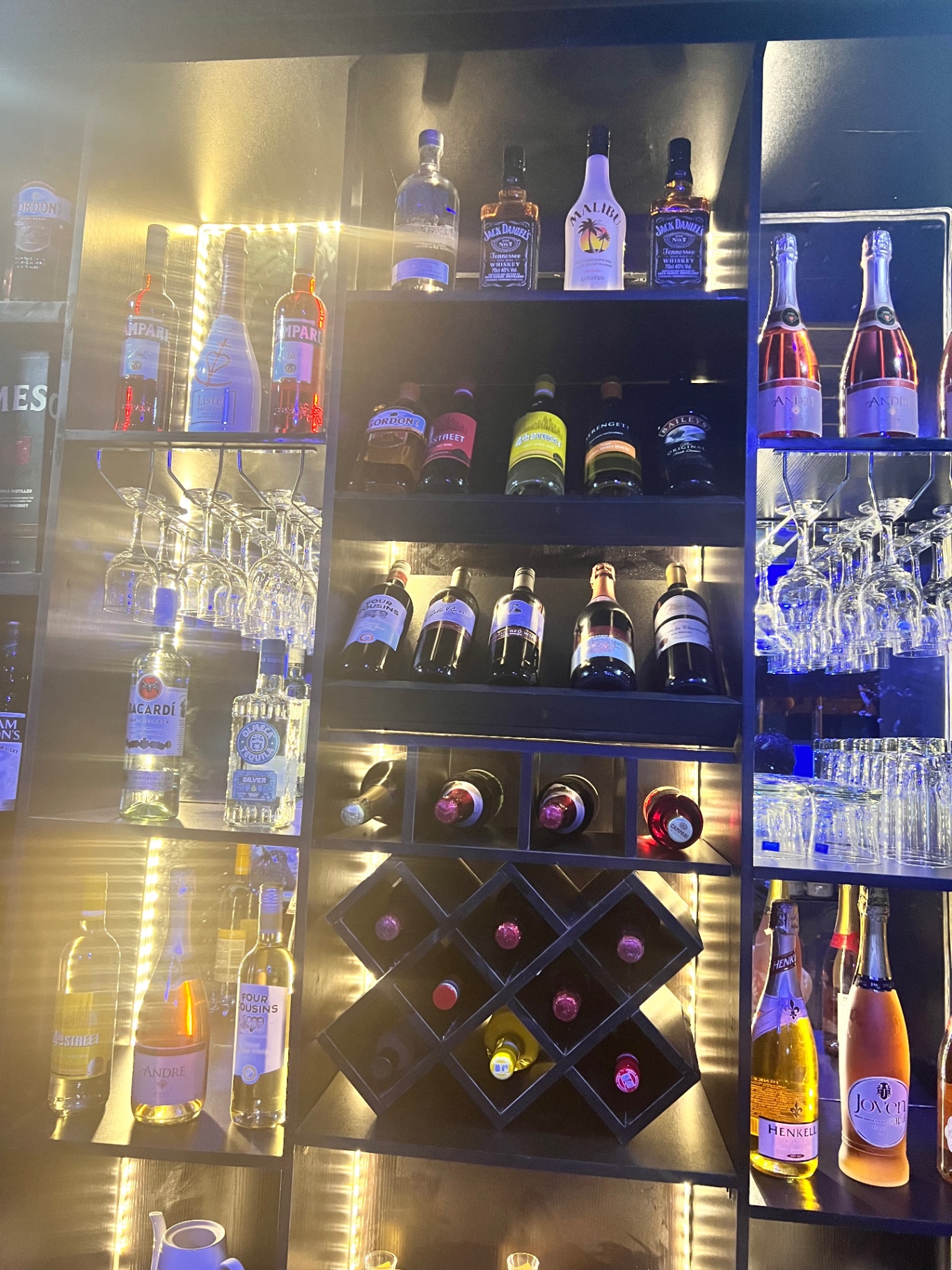 The backlit bar shelf at Podium Empire