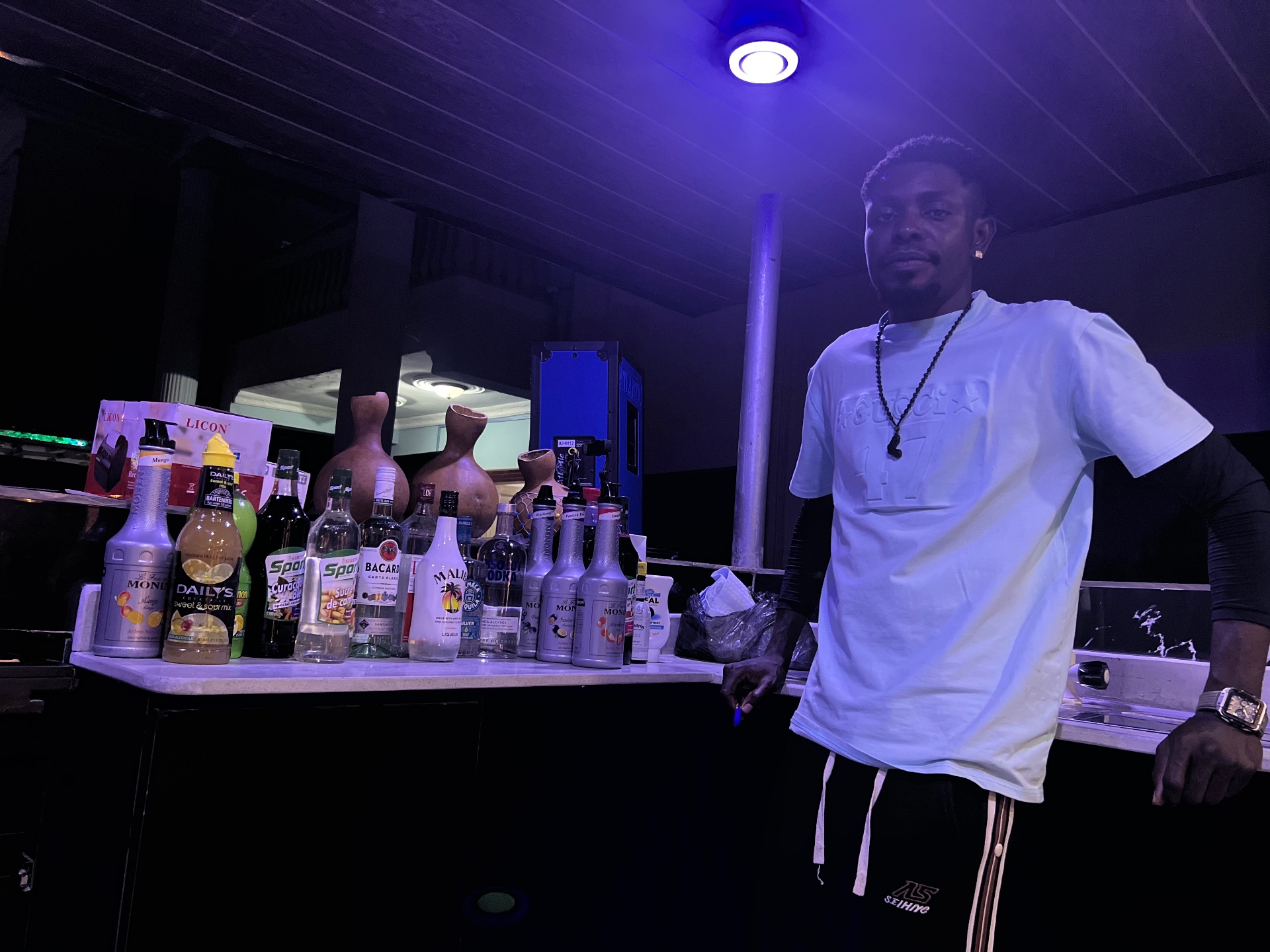 Bartender mixing drinks at the outdoor bar